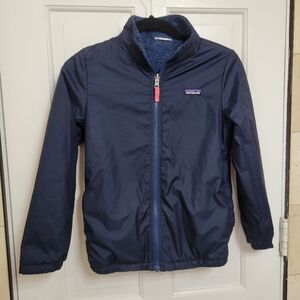 Patagonia Reversible youth jacketit has fleece inside.